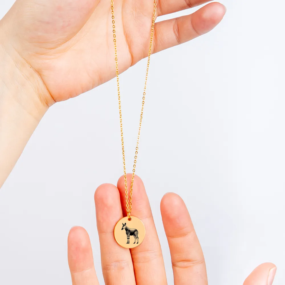 Okapi amulet necklace featuring a beautiful silhouette, a must-have accessory.