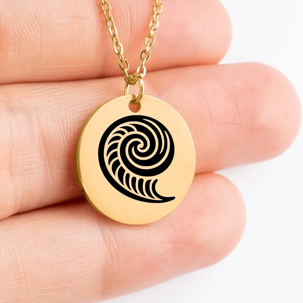 Handcrafted custom Koru medallion jewelry charm