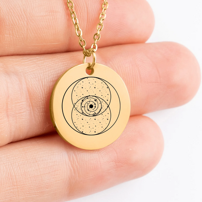 Engraved Vesica Piscis coin charm on stylish medallion accessory